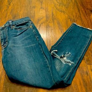 Distressed ankle jeans